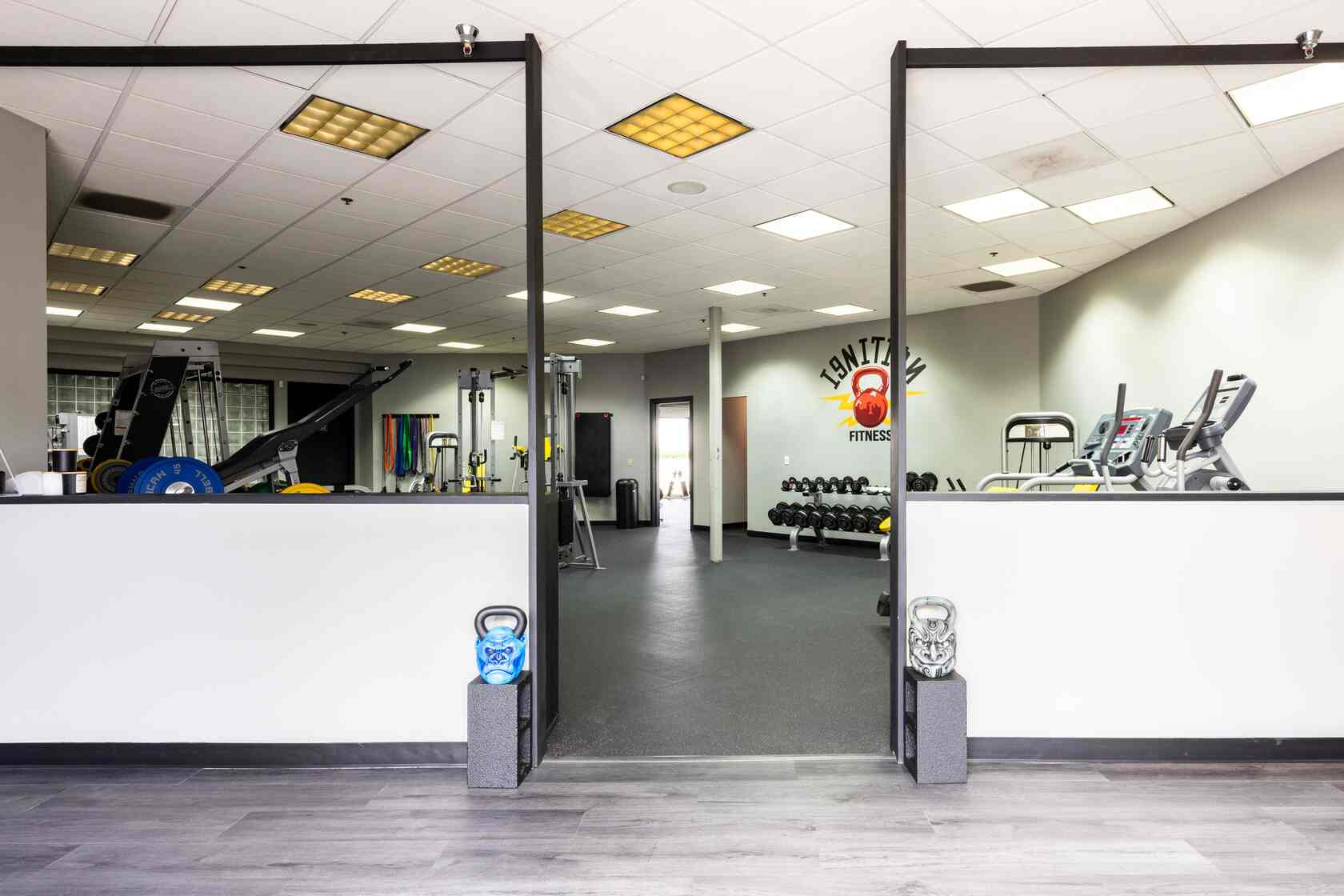 Glass entry hallway leading to gym floor