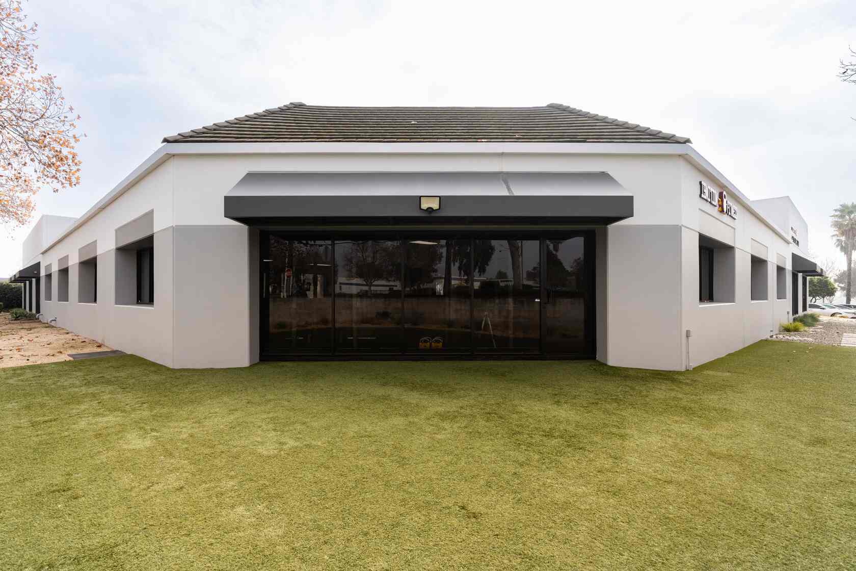 Ignition Fitness building exterior with turf lawn
